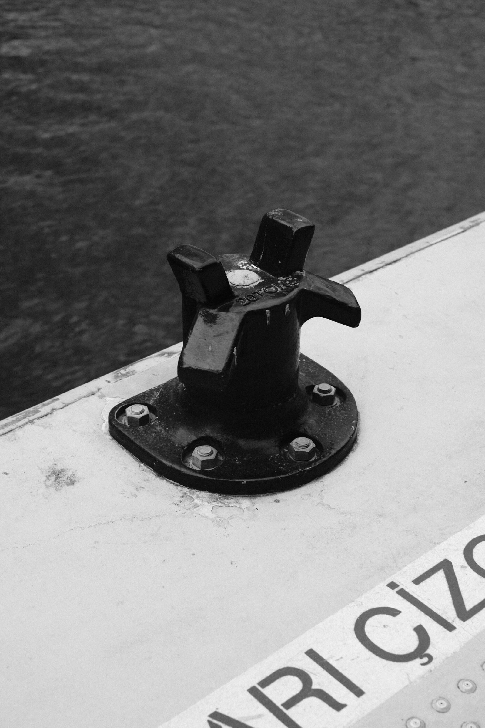 a black and white photo of a boat in the water